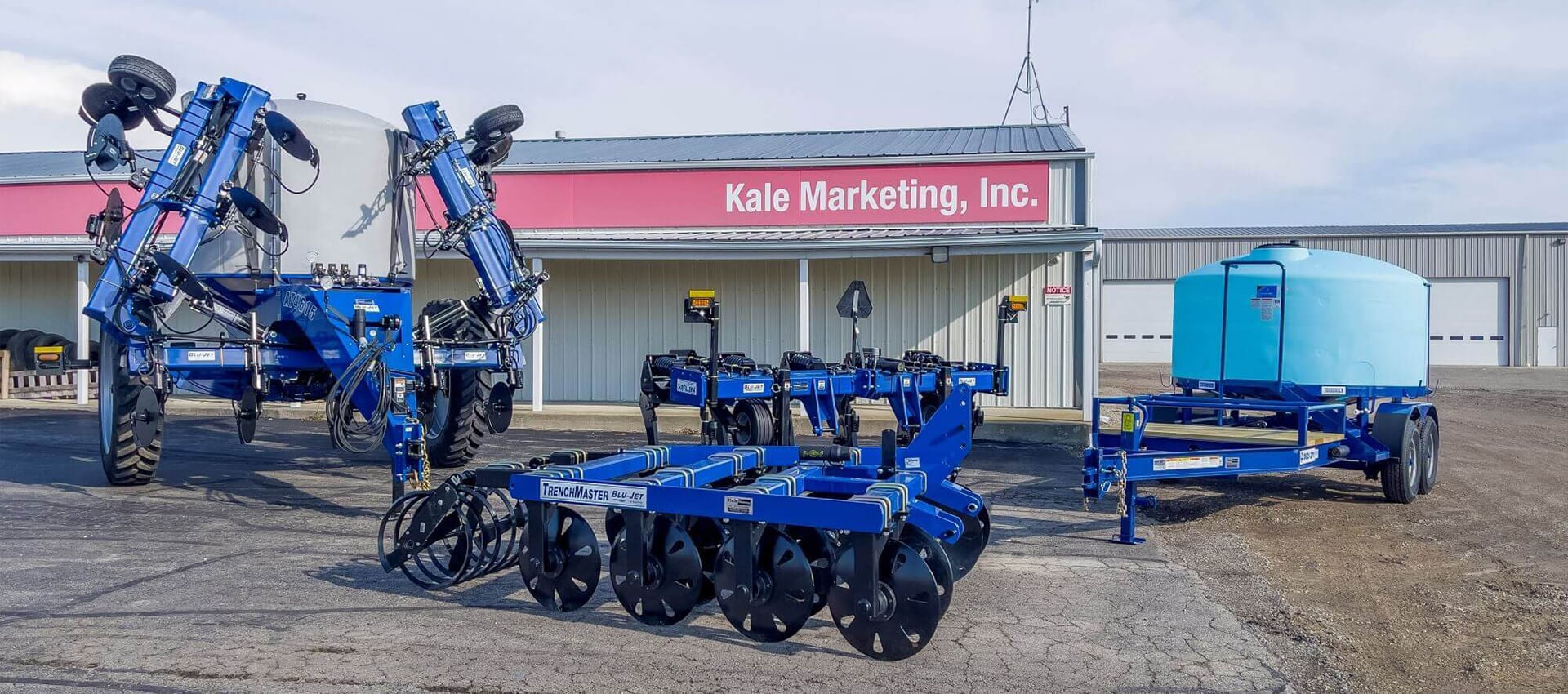 Blu Jet AT4615 Tiller, Blu Jet TrenchMaster Tiller, Blu Jet SubTiller 4, & Blu Jet Duo Lift Tank TD1300SCB in front of Kale Marketing, Inc.