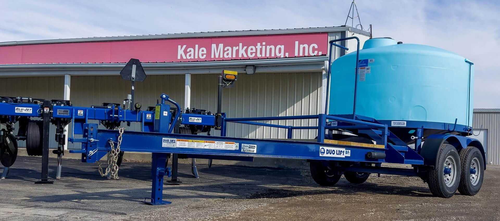Blu Jet Duo Lift Tank TD1300SCB & Blu Jet Tiller in front of Kale Marketing, Inc.